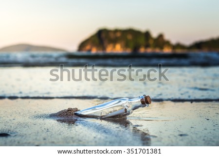 Message in a bottle with beach Royalty-Free Stock Photo #351701381