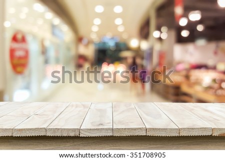 Empty top wooden table and blur with bokeh background. For product display