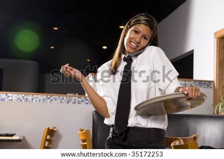 Waitress on her cellphone
