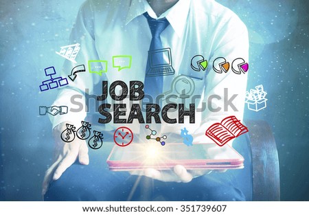 businessman holding a tablet computer with JOB SEARCH text ,business concept 
