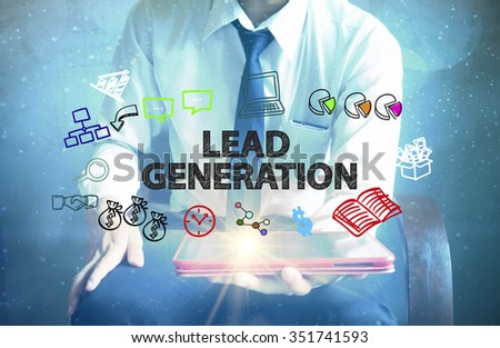 businessman holding a tablet computer with LEAD GENERATION text ,business concept 