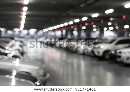 blurred car parking with bokeh light Background