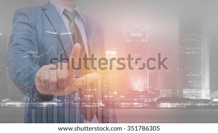 Double exposure of business man with modern building background