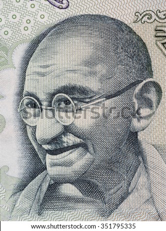Mahatma Gandhi portrait on indian 100 rupee banknote macro, India money closeup Royalty-Free Stock Photo #351795335