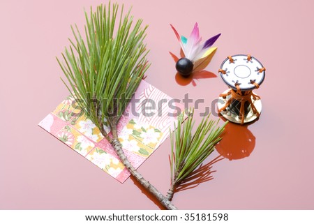 SEASONAL IMAGE-a battledore's wing, drum ornament, pine needles and a Japanese paper for celebration of New Year's Day