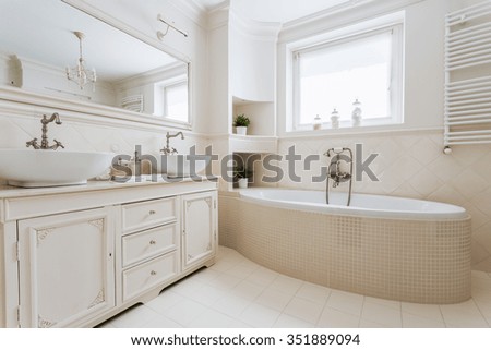 Horizontal picture of luxurious bathroom with window in french style