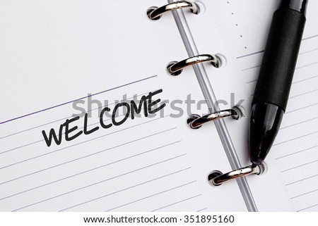 WELCOME word written on notebook