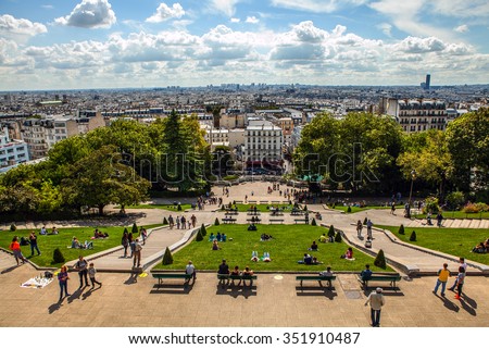 View from Montmartre to summer Paris and beautiful blue sky with soft clouds. Royalty-Free Stock Photo #351910487