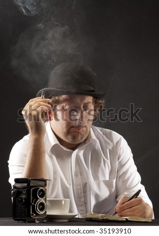 Photojournalist in bowler hat sitting at table smoking, writing. The image is in 1950's style