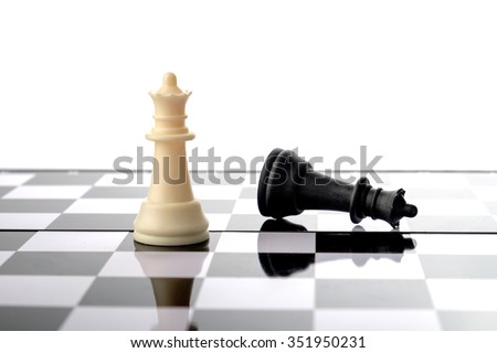 Chess pieces, queen and fallen king. Strategy and competition conceptual.