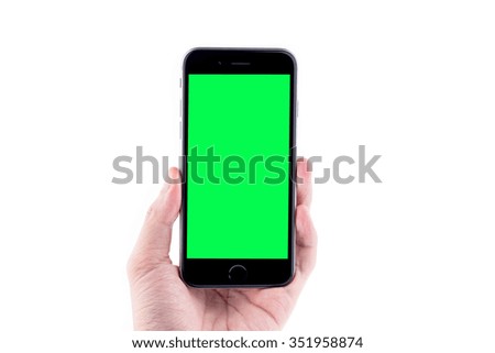  Hand holding the black smartphone with blank screen, isolated on white background.