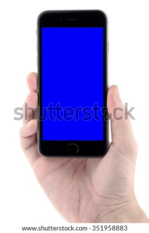 Hand holding the black smartphone with blank screen, isolated on white background.