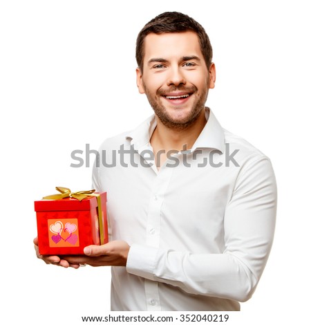 Young man carries a lot of presents, isolated on white