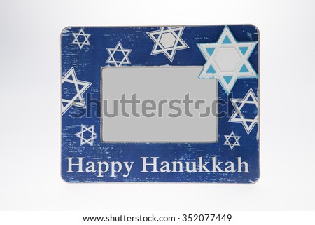 A Hanukkah picture frame against a white background