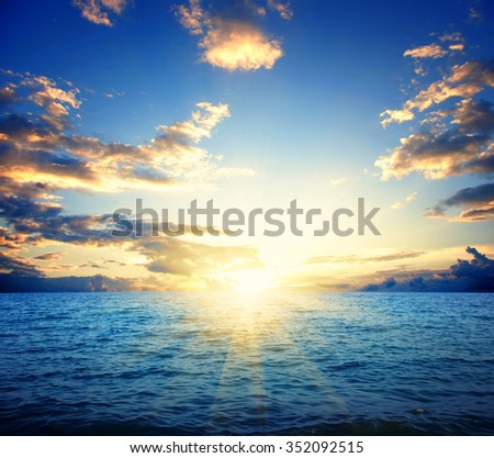 Blue sea and sun on sunset