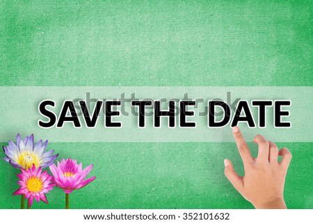 pointing hand "SAVE THE DATE" on the wall background 