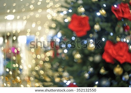 Blurred Christmas lights with a fir tree