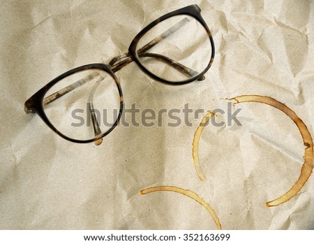 old glasses with grunge paper texture background