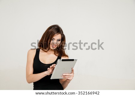 young woman holding tablet pc 