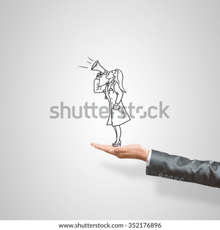 Drawn woman doctor in female palm on gray background