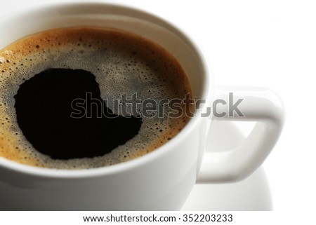 A cup of tasty coffee, isolated on white, close-up