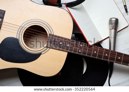 Close up view on musical equipment against grey wooden background