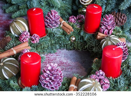 Advent wreath with red candles. Selective focus on remote candles. 