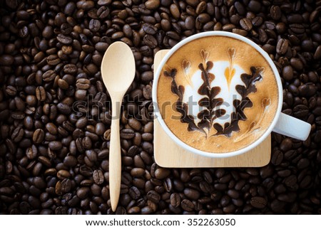 latte art coffee on coffee beans background