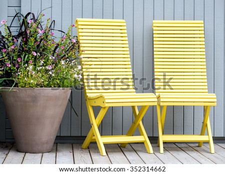 Yellow chairs in the garden.