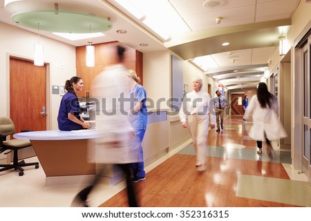 Busy Nurse's Station In Modern Hospital Royalty-Free Stock Photo #352316315