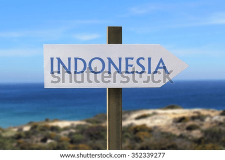 Indonesia sign with seaside in the background