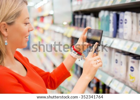 Woman taking picture of products 