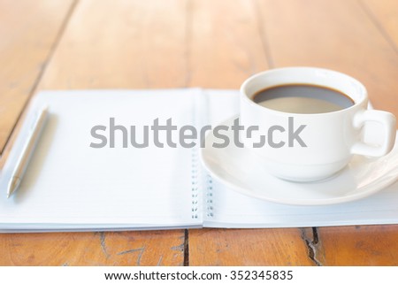 Blank note book with cup of coffee and pen, Vintage style