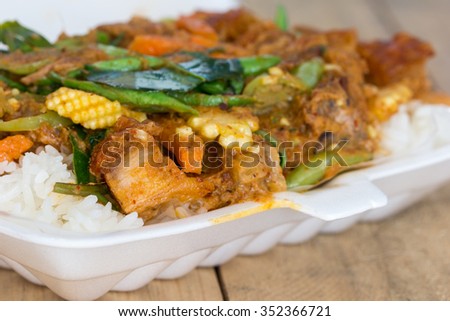Stir fried Crispy pork with Red Curry on jasmine rice