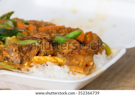 Stir fried Crispy pork with Red Curry on jasmine rice