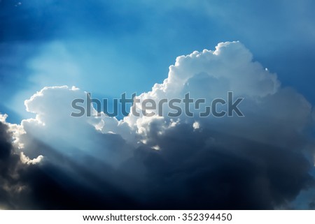 Dramatic Clouds and Sky with Sunbeam