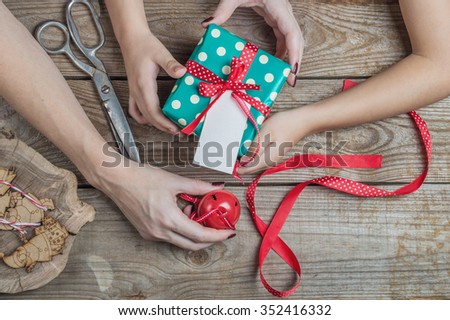 mother and child prepare gifts for Christmas