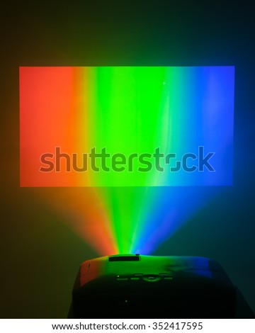 projector in action with illuminated rgb screen