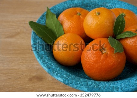 tangerine on blue plate
