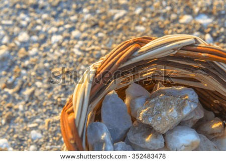 Pebbles in a basket. Small stones easily found on greek islands.