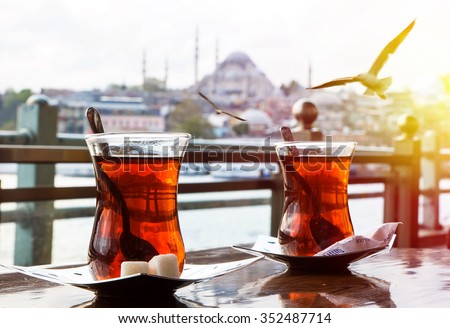 Turkish tea cup on the background of port in Istanbul Royalty-Free Stock Photo #352487714