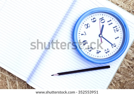 clock and notebook