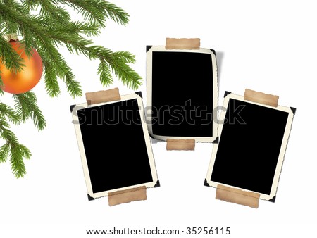 branches of a Christmas tree with fur-tree toy and frame for photo