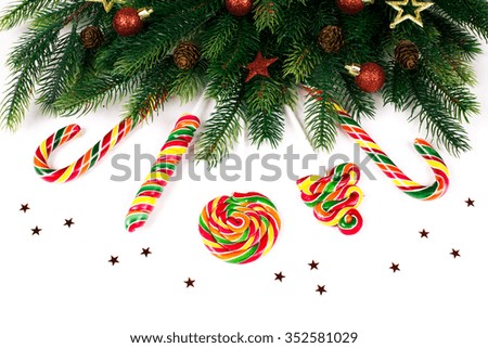 Christmas tree branches with decoration and candy