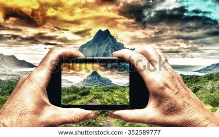 Man and woman hand capturing Polynesian Island landscape with smartphone.