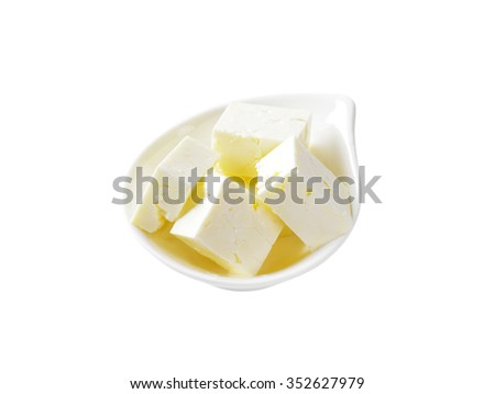 bowl of feta cheese cubes on white background