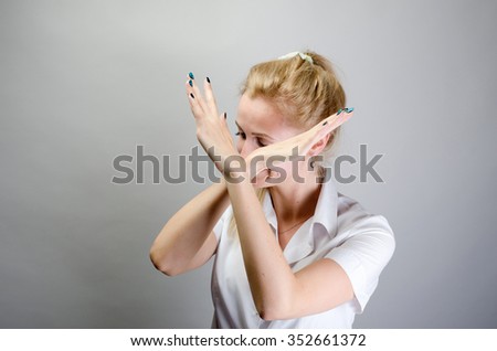 girl showing stop arms crossed