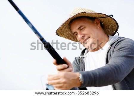 Picture of fisherman fishing with rods