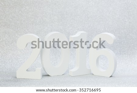 2016 year white wood number with sparkling wall background