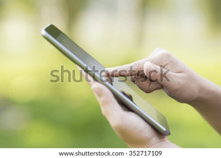 Woman Use Tablet at Park